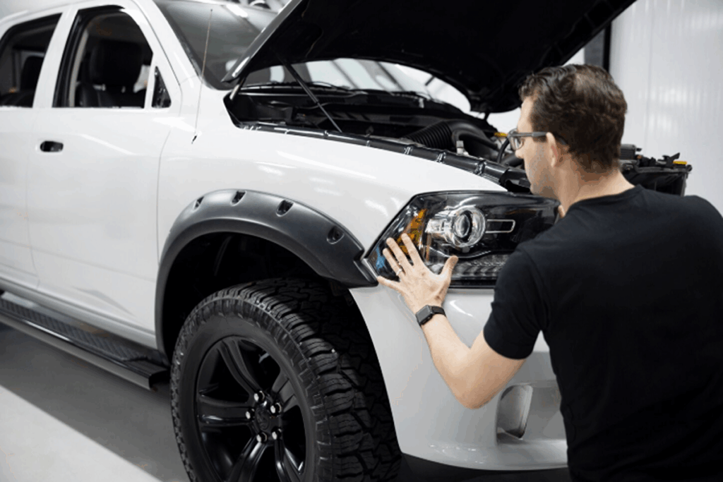 Mechanist repairing the car after a collision