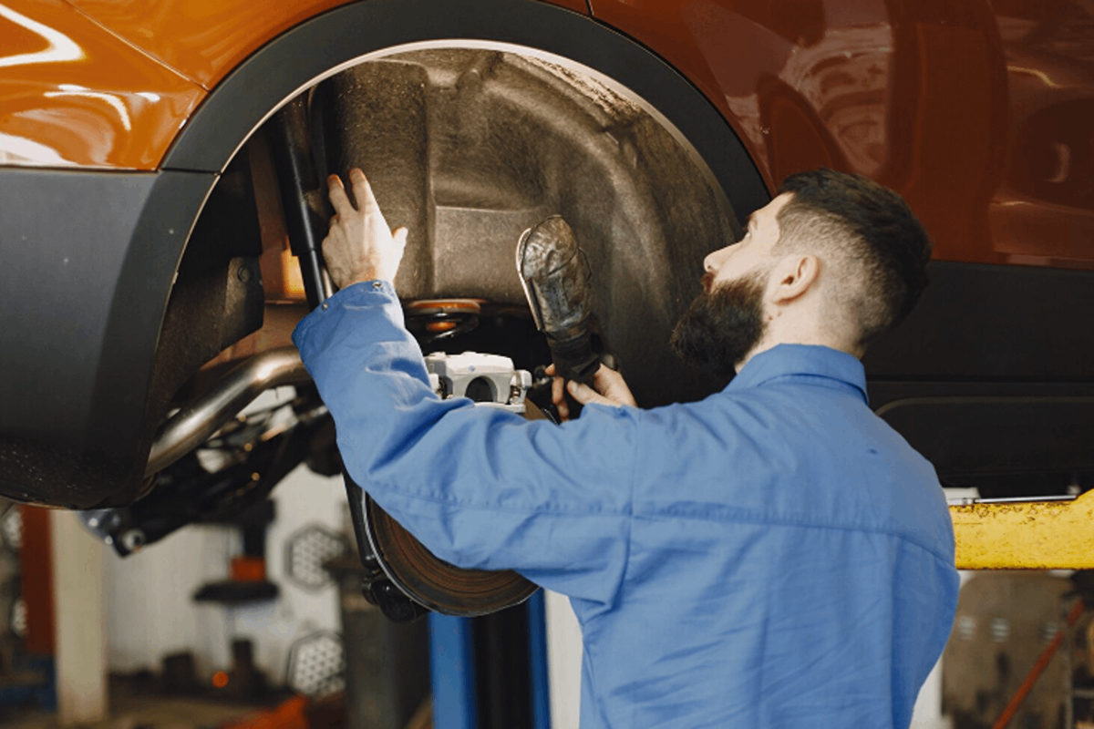 Mechanist examining how to protect the car’s value after a collision